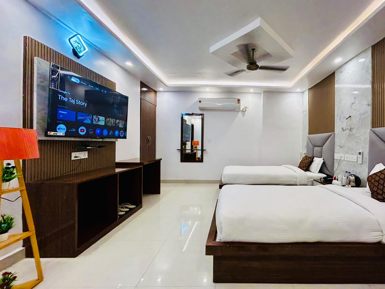 Tathagat Suite twin beds and smart TV